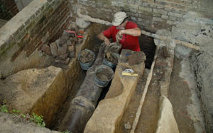 Excavating the 18th-c. sump feature that was abandoned c.1800