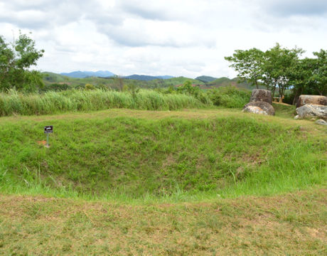 A bomb crater on the Plain of Jars in Laos