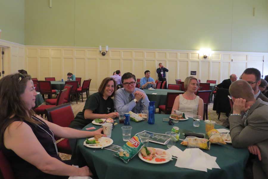 Professors Paga, Panoussi, and Nichols attending lunch with attendees on Friday