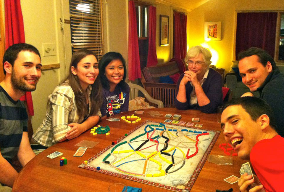 Ann Reed plays Ticket to Ride with Linguistics students