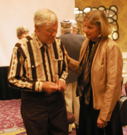 Prof. Katherine Preston speaks to “Doc” Watson, an icon of traditional American music, after presenting him with an Honorary Membership Award by the Society for American Music at their annual conference in Charlotte in 2012. Preston was President of the Society.