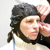 Jennifer Stevens is fitted with an electrode-bearing skullcap by Chris Ball.
