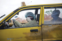 Sept. 3, 2014, Monrovia, Liberia: A taxi driver brings a sick woman to an Ebola clinic.