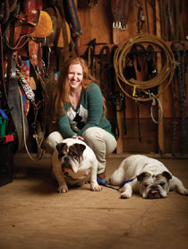 Elisabeth Custalow ’01 volunteers as executive director of Four Feet Forward. She has two dogs, Tank and Winston, and two horses, Breezy and Emma. Photo by Adam Ewing