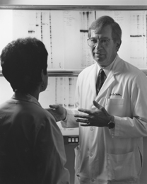DeVita discusses lab results with a researcher at Yale Cancer Center where he served as director from 1993-2004. He is now the Amy and Joseph Perella Professor of Medicine at Yale. (Photo courtesy of Farrar, Straus and Giroux)