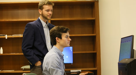 Alex Williams '17 and Psychology Professor Chris Conway analyze data from an experiment, including the participant's physiological signs of fear, in the lab.  Photo by Stephen Salpukas