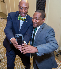 One of Saturday night's honorees, Warren W. Buck, takes a selfie with Jason Simms, associate athletics director. (Photo by Skip Rowland '83)