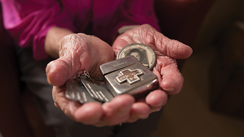 Time capsule: Allen displays her dog tags, Red Cross Zippo lighter and I.D. badge from Ream General Veterans Hospital, where she worked at the beginning of World War II.