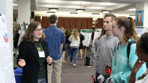A student shares with attendees of the symposium. (Photo by Andy Harris)
