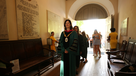 President Rowe walks through a hallway in the Wren Building
