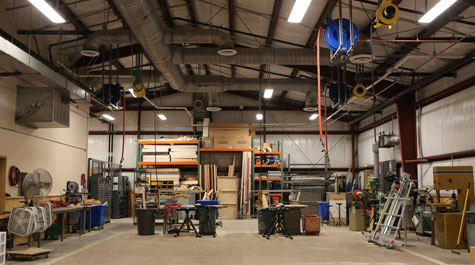 Scene shop with equipment, tools, cabinets, work area