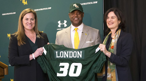 Huge with football coach Mike London and President Katherine Rowe