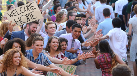 William & Mary students welcome the freshman class with high-fives at the 2019 Opening Convocation ceremony.