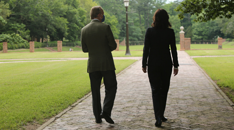 Two people walk toward the Sunken Garden