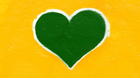 A great heart outlined in white on a yellow background