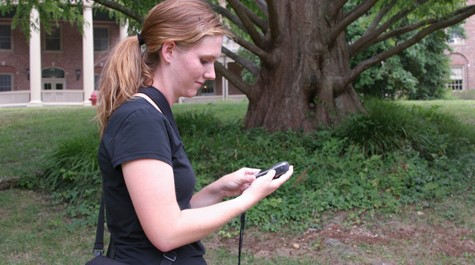 Allyson Jackson looks at a handheld electrical device