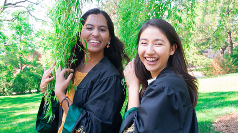 Shivani Gupta ’20 and her roommate Mina Parastaran ’20 in graduation gowns