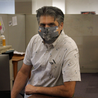 David Morales wearing a face mask