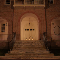 Wren Building entrance with three lit lanterns at top of stairs