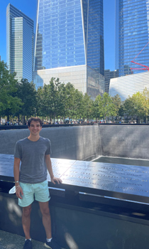 James Lynch in front of his father's name, Robert Henry Lynch, Jr., at the 9/11 Memorial in New York. (Courtesy photo)
