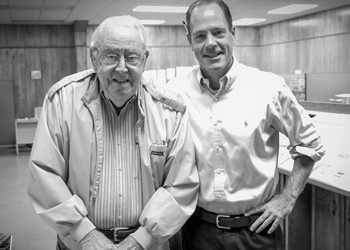 Billy Coleburn ’90 and his father, Doug Coleburn, are the brains behind the Courier-Record newspaper, owned by their family since 1946. (Courtesy photo)
