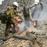 Evan Kikla '21 (left) and fellow firefighter work on an initial attack of a lightning-started fire in Eastern Oregon in 2015. (Courtesy photo)