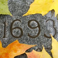 University charter year 1693 etched in stone. Fall theme.