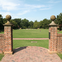 View of Sunken Garden through brick gate at east end.
