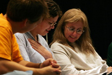 Laurie Wolf (r) joins in the playreading along with (from left) Noah Foreman and Mary Davenport. Photo by David Williard.