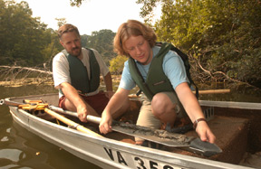 Holly Packard ’07 collects sediment samples from Lake Matoaka with Matthew Evans, assistant professor of geology. Both Evans and Packard’s work is supported by a grant from The Andrew W. Mellon Foundation.