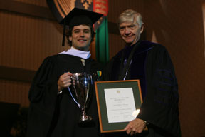 Kennedy receives the Carr Cup from Interim President Reveley. By Stephen Salpukas.