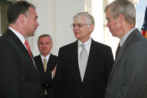 W&M Interim President W. Taylor Reveley III (center) and alumnus Jim Murray (J.D. '74) talk with Gov. Kaine (left) at the bill signing ceremony. By Stephen Salpukas.