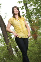 Carlos Miele's signature use of transparent and flowing silk chiffon is evident in this mustard blouse worn by Katherine McCarney ’10.