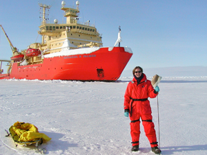 VIMS professor Rebecca Dickhut on Antarctic sea ice in front of the research vessel Nathaniel B. Palmer