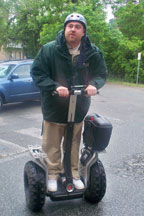 Parking enforcement officer Jason Hamlin takes a spin on one of the College's Segways