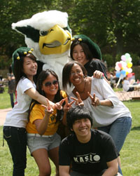 Students pose for a photo with the Griffin during a recent Day for Admitted Students. (Photo by Stephen Salpukas)
