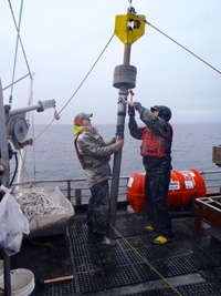 VIMS graduate student Eric Miller (L) and professor Steve Kuehl (R) prepare to core seafloor sediments in Prince William Sound, Alaska.
