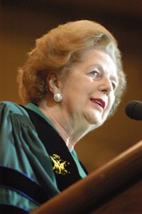 Thatcher, wearing the Chancellor's regalia, speaks at a W&M event.