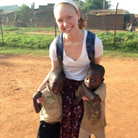 Research assistant Laura Pugh '15 with children in Mbale, Uganda. Pugh studied the role of maternal capacities of child feeding and hygiene practices.