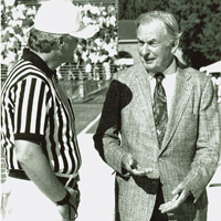Walt Zable and an official chatting before a Tribe football game
