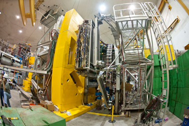 Even though the assembled QWeak apparatus dwarfs its creators at JLab, the experiment is considered a “finesse” operation in comparison to detectors at Fermilab and CERN. Photo courtesy of JLab