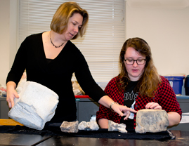 Rowan Lockwood and her student Kat Turk discuss some (non-Cornwallis) whale fossils in a William & Mary geology lab. Turk continued to work on Cornwallis at the labs at the Virginia Museum of Natural History.  Photo by Joseph McClain 