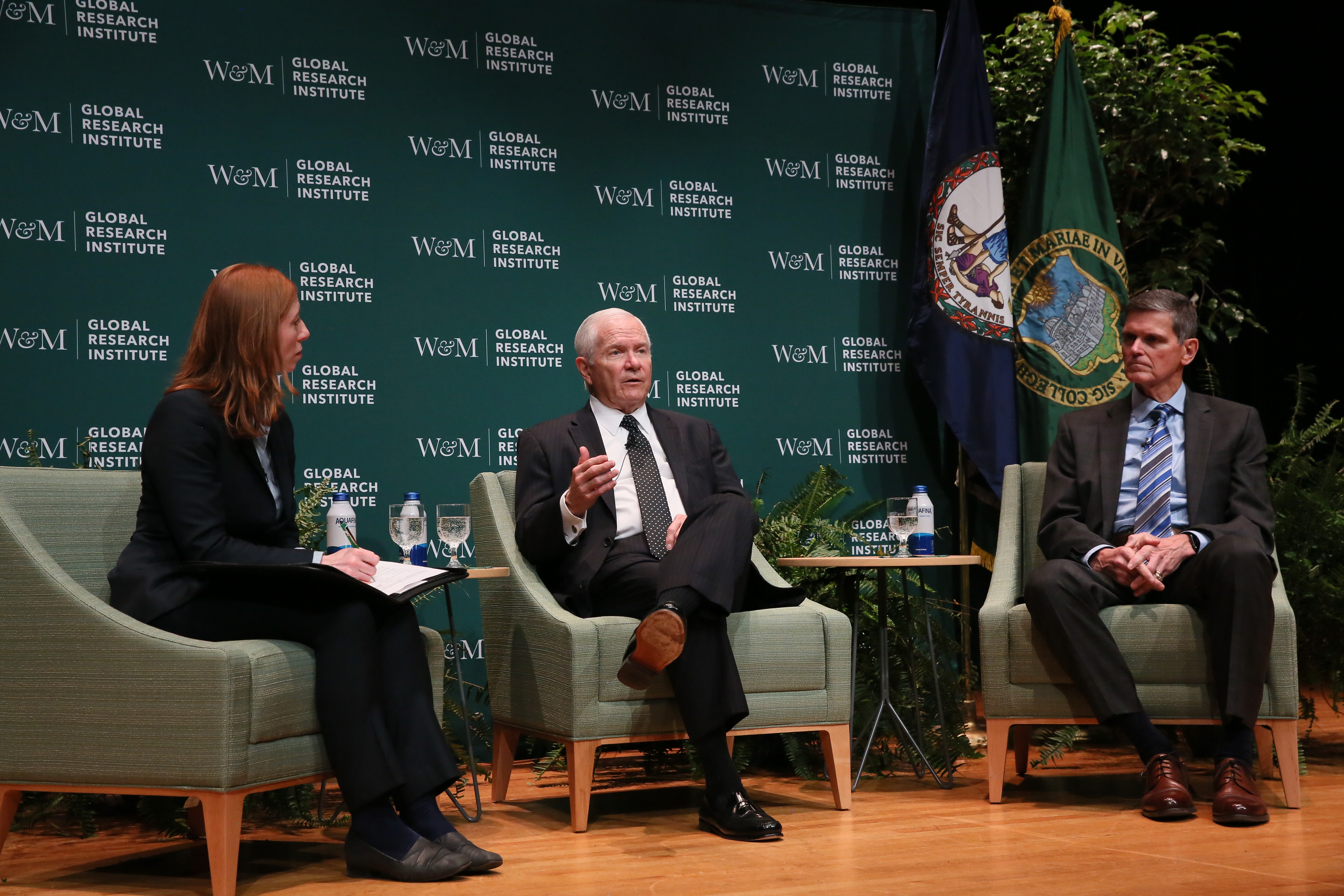 Chancellor Gates in conversation with General Votel and Sam Custer.