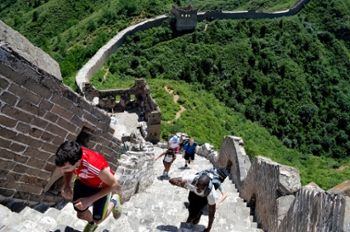 W&M students climb steps at the Great Wall of China in Beijing.  Photo by David So.