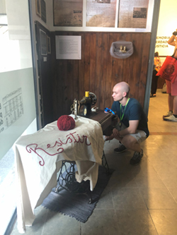 Ethan Meidinger '25 examines an exhibit at the Pergamino Memory Site (Photo credit: Silvia Tandeciarz)