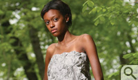 Kendall Simmons '09 wears a strapless pewter dress...