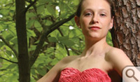 Graduate student Kristin Reardon models a strapless raspberry dress...