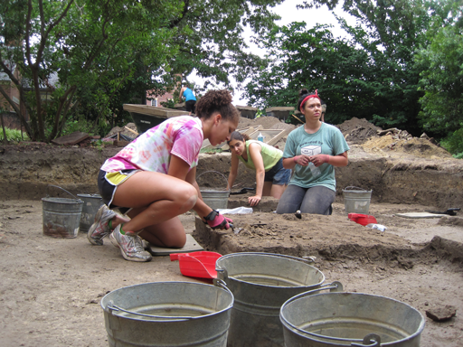 Using trowels, field school participants (from left) Celine Alasomuka ’14, Teaching Assistant Rebecca Schumann M.A. ’13 and Julia Gibson ’13 