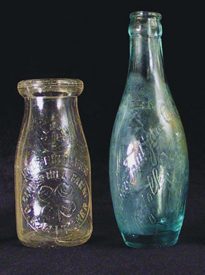 Both of these early 20th century bottles were found at Site 44PY181. The dairy bottle (left) is from Clover Hill Farm in Danville. The bottle on the right would have contained one the soft drinks manufactured by the Virginia Fruit Juice Co. of Norfolk. Numerous other identifiable bottles from the sites Front Street tell us about the types of consumer goods available to mill families and where they were manufactured. (left - 5-3/8in  tall, from Feature 14, L.I [privy]; right - 7-3/8in tall, from Feature 18 [builder's trench])
