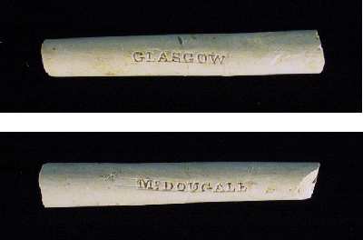 Opposite sides of a colonial-period clay tobacco pipe stem stamped with its place of origin (Glasgow, Scotland) and the name of the manufacturer (McDougall).